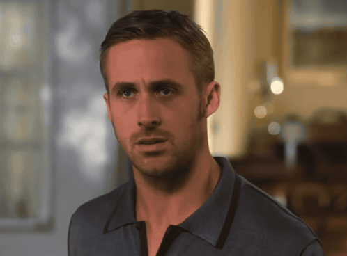 A Close Up Of A Man 'S Face With A Blue Shirt On GIF