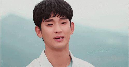 A Close Up Of A Man 'S Face With A Blue Sky Behind Him GIF
