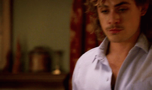 A Close Up Of A Man 'S Face With A Blurred Background GIF