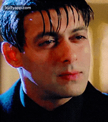 A Close Up Of A Man 'S Face With A Blurred Background . GIF