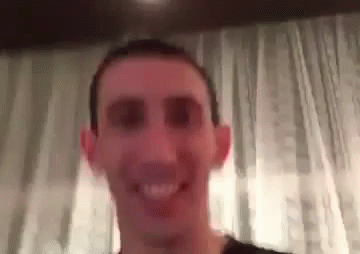 A Close Up Of A Man 'S Face With A Blurred Background . GIF