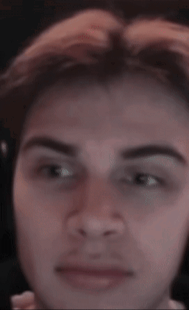 A Close Up Of A Man 'S Face With A Blurred Background GIF