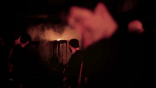A Close Up Of A Man 'S Face With A Blurred Background GIF
