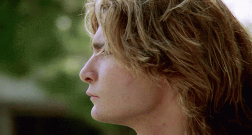 A Close Up Of A Man 'S Face With A Blurred Background GIF