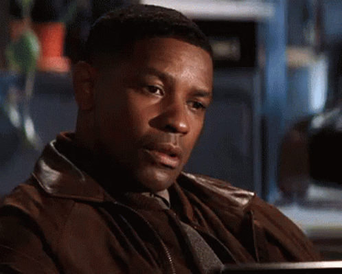 A Close Up Of A Man 'S Face With A Blurred Background GIF