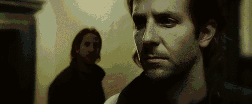 A Close Up Of A Man 'S Face With A Blurred Background GIF