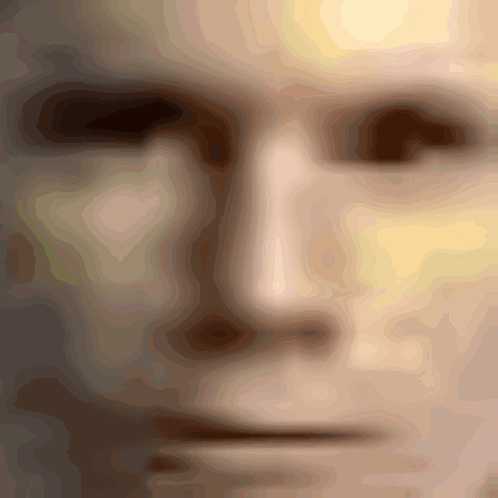 A Close Up Of A Man 'S Face With A Blurred Image GIF