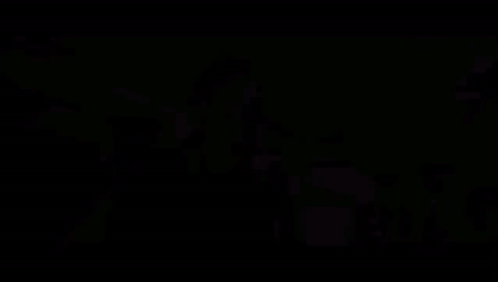 A Close Up Of A Man 'S Face With A Blurry Background Behind Him GIF