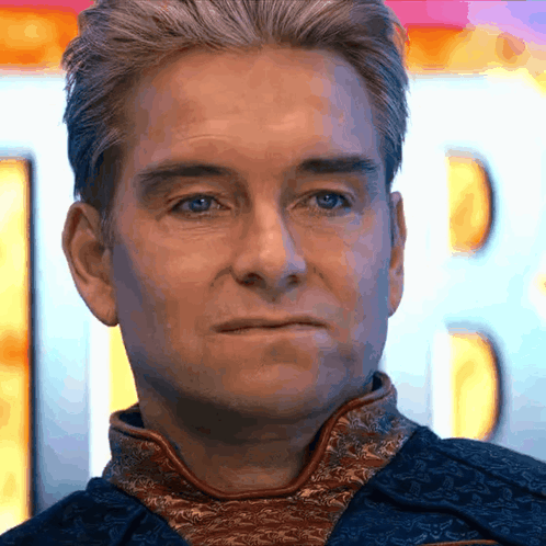 a close up of a man 's face with a blurry background