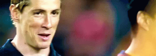 A Close Up Of A Man 'S Face With A Blurry Background . GIF