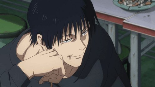 A Close Up Of A Man 'S Face With A Cigarette In His Mouth GIF