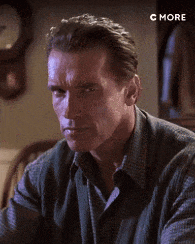 A Close Up Of A Man 'S Face With A Clock In The Background And The Word C More Below Him GIF