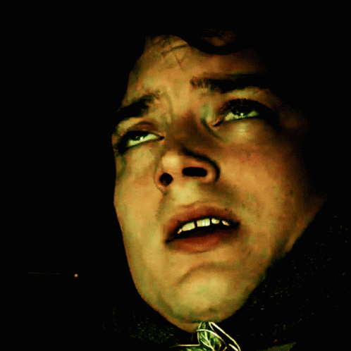 A Close Up Of A Man 'S Face With A Cross On It GIF