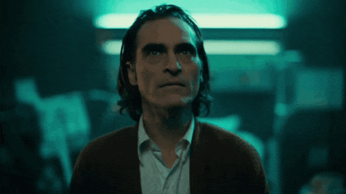 Close Up Of Man's Face With Dark Background GIF