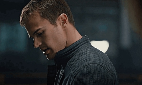 A Close Up Of A Man 'S Face With A Dark Background GIF