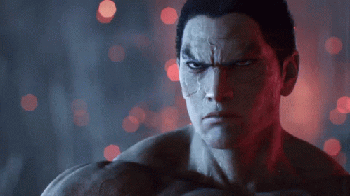 A Close Up Of A Man 'S Face With A Dark Background GIF