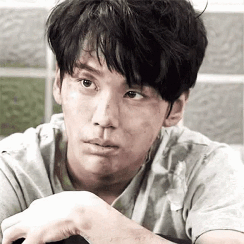 A Close Up Of A Man 'S Face With A Dirty Face And A Dirty Shirt . GIF
