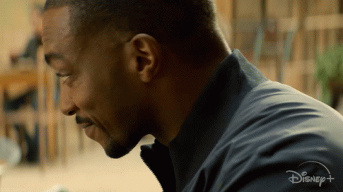A Close Up Of A Man 'S Face With A Disney + Logo Visible GIF