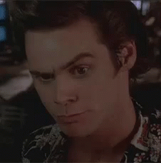 A Close Up Of A Man 'S Face With A Floral Shirt On . GIF