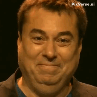 A Close Up Of A Man 'S Face With A Funny Face . GIF