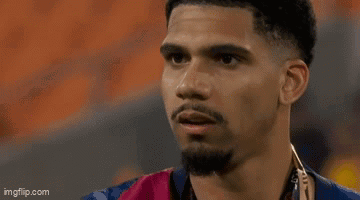 A Close Up Of A Man 'S Face With A Hand On His Face . GIF