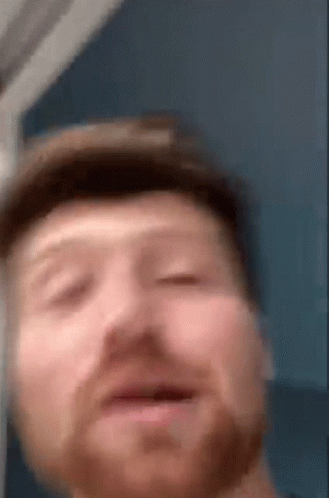 A Close Up Of A Man 'S Face With A Hat On GIF