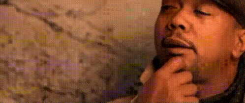 A Close Up Of A Man 'S Face With A Hat On GIF