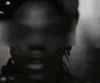 A Close Up Of A Man 'S Face With A Hat On . GIF