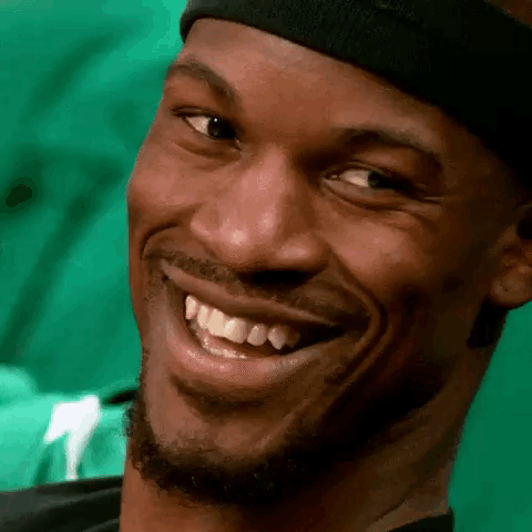 A Close Up Of A Man 'S Face With A Headband On Smiling . GIF