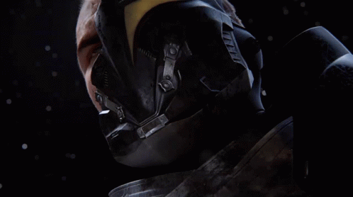 A Close Up Of A Man 'S Face With A Helmet And Gloves On GIF
