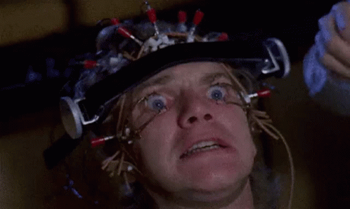 A Close Up Of A Man 'S Face With A Helmet On His Head . GIF