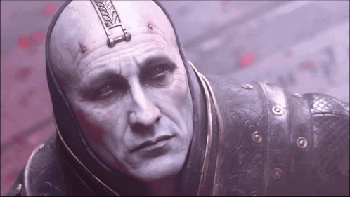 A Close Up Of A Man 'S Face With A Helmet On GIF
