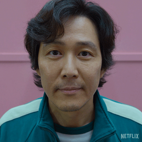 A Close Up Of A Man 'S Face With A Jacket That Says Netflix On It GIF