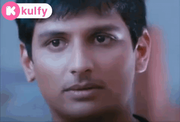 A Close Up Of A Man 'S Face With A K Kulfy Logo Behind Him GIF