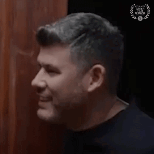 Close-Up Of Man's Face With Laurel Wreath GIF