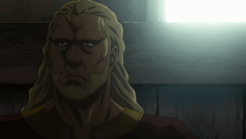 A Close Up Of A Man 'S Face With A Light Behind Him GIF