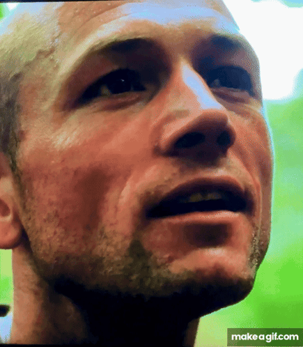 A Close Up Of A Man 'S Face With A Make A Gif.com Watermark GIF