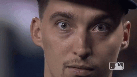 A Close Up Of A Man 'S Face With A Mlb Logo On The Bottom GIF