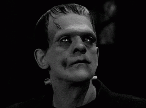 A Close Up Of A Man 'S Face With A Monster 'S Head . GIF