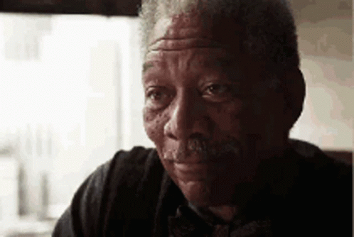 A Close Up Of A Man 'S Face With A Mustache . GIF