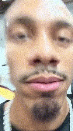 A Close Up Of A Man 'S Face With A Mustache And Pink Lips GIF