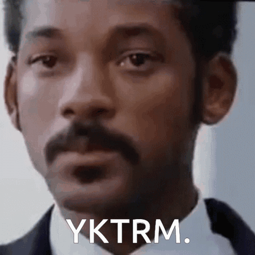 A Close Up Of A Man 'S Face With A Mustache And The Words Yktrm . GIF