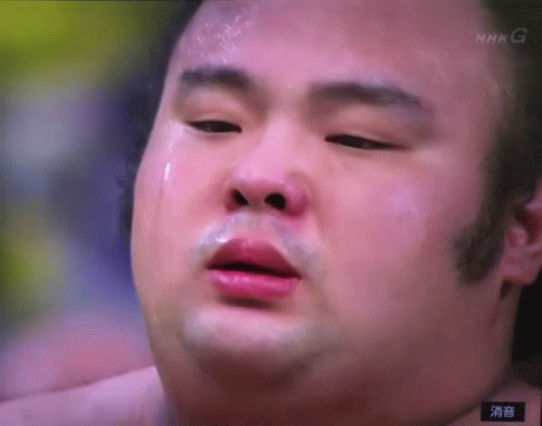 A Close Up Of A Man 'S Face With A Nhk G Logo In The Corner GIF