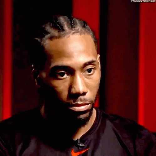 A Close Up Of A Man 'S Face With A Nike Logo On His Shirt GIF
