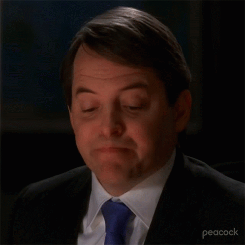 A Close Up Of A Man 'S Face With A Peacock Logo In The Corner GIF