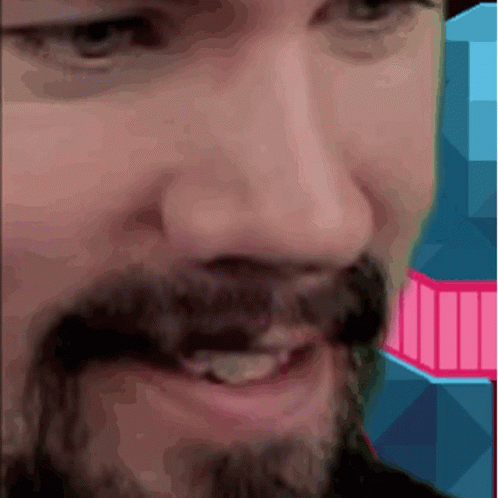A Close Up Of A Man 'S Face With A Pink And Blue Background GIF