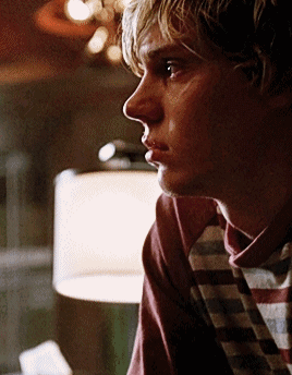 A Close Up Of A Man 'S Face With A Plaid Shirt On GIF
