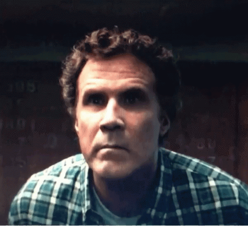 A Close Up Of A Man 'S Face With A Plaid Shirt On GIF