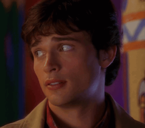 A Close Up Of A Man 'S Face With A Purple Background GIF