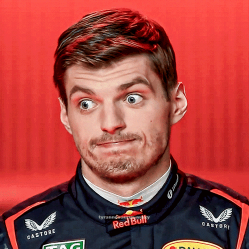 A Close Up Of A Man 'S Face With A Red Bull Shirt On GIF